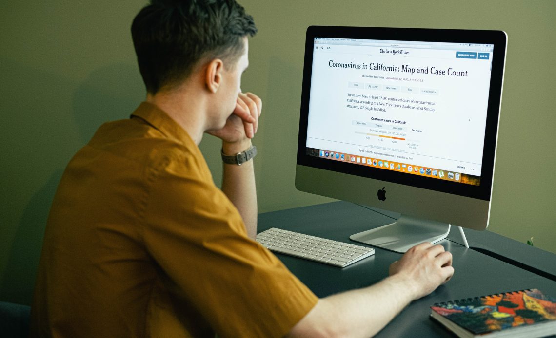 a developer is looking at a computer screen and testing a historical news API