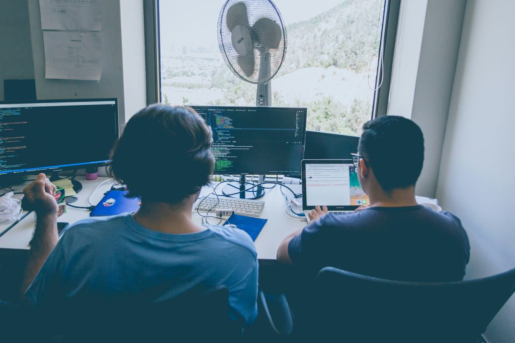 two developers using forex api