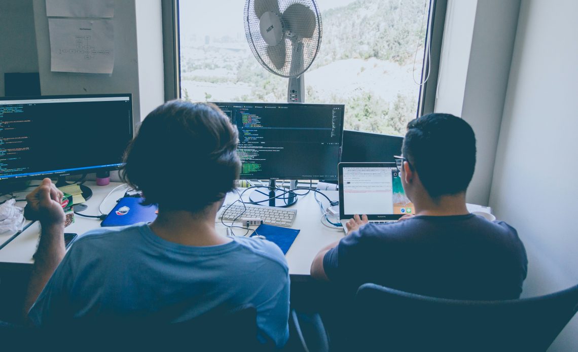 two developers using forex api